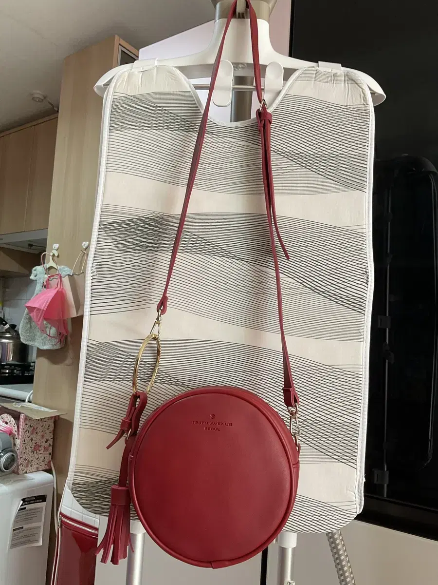 Red cylindrical handbag