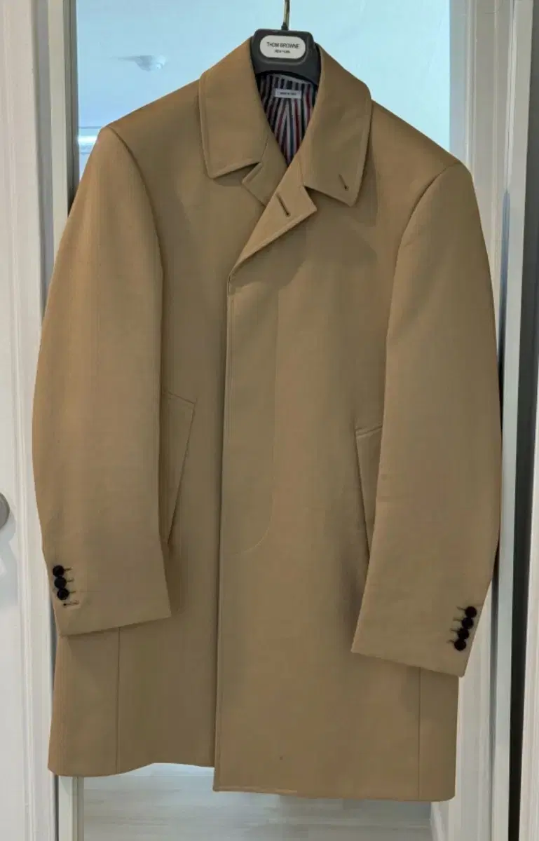 I am selling a Thom Browne Mac Coat size 3 (105) [worn twice].