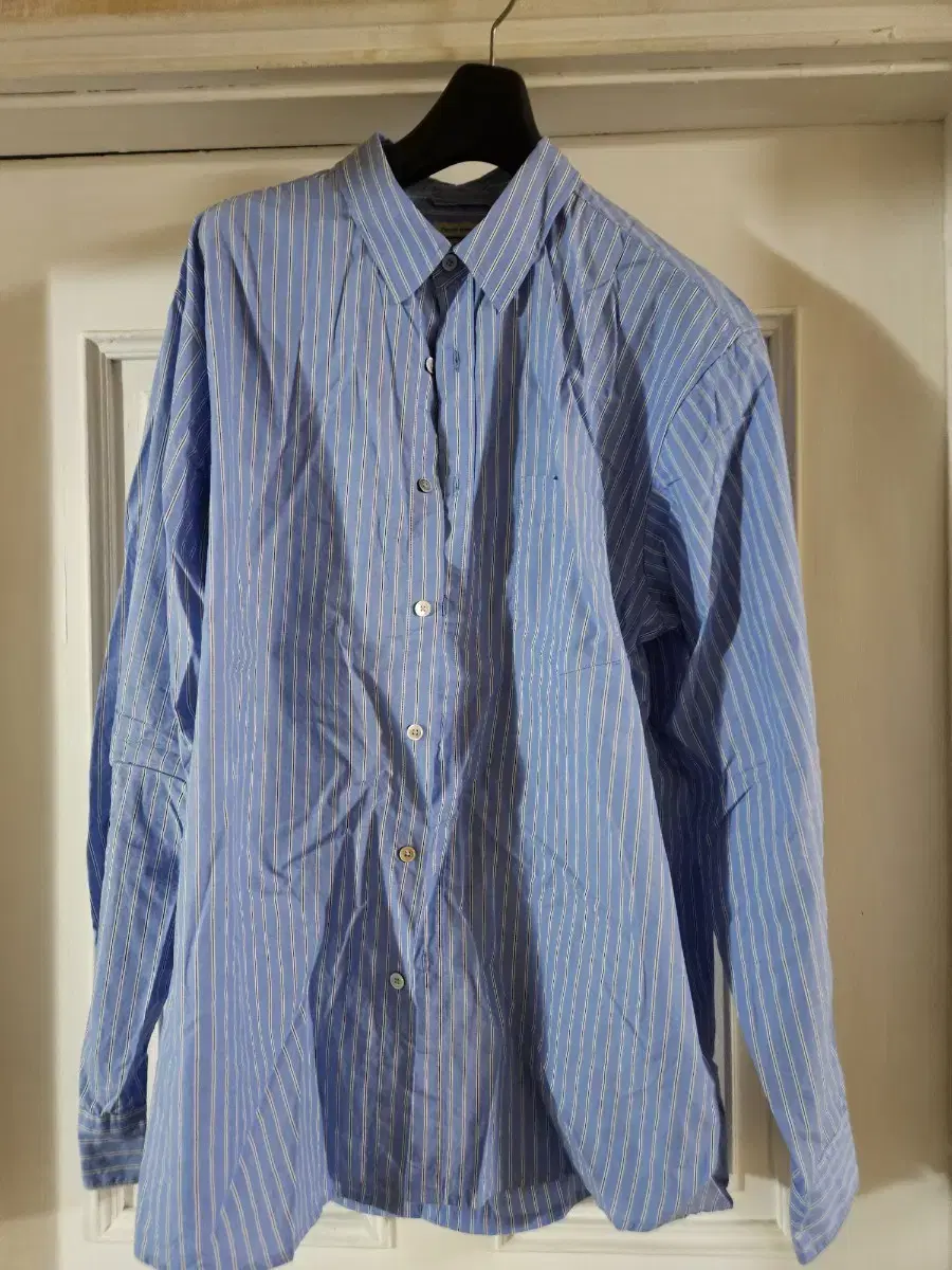 I'm selling a shutter stripe shirt in size M.