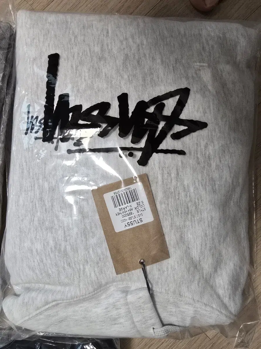 Take the stussy hoodie and keep the new one