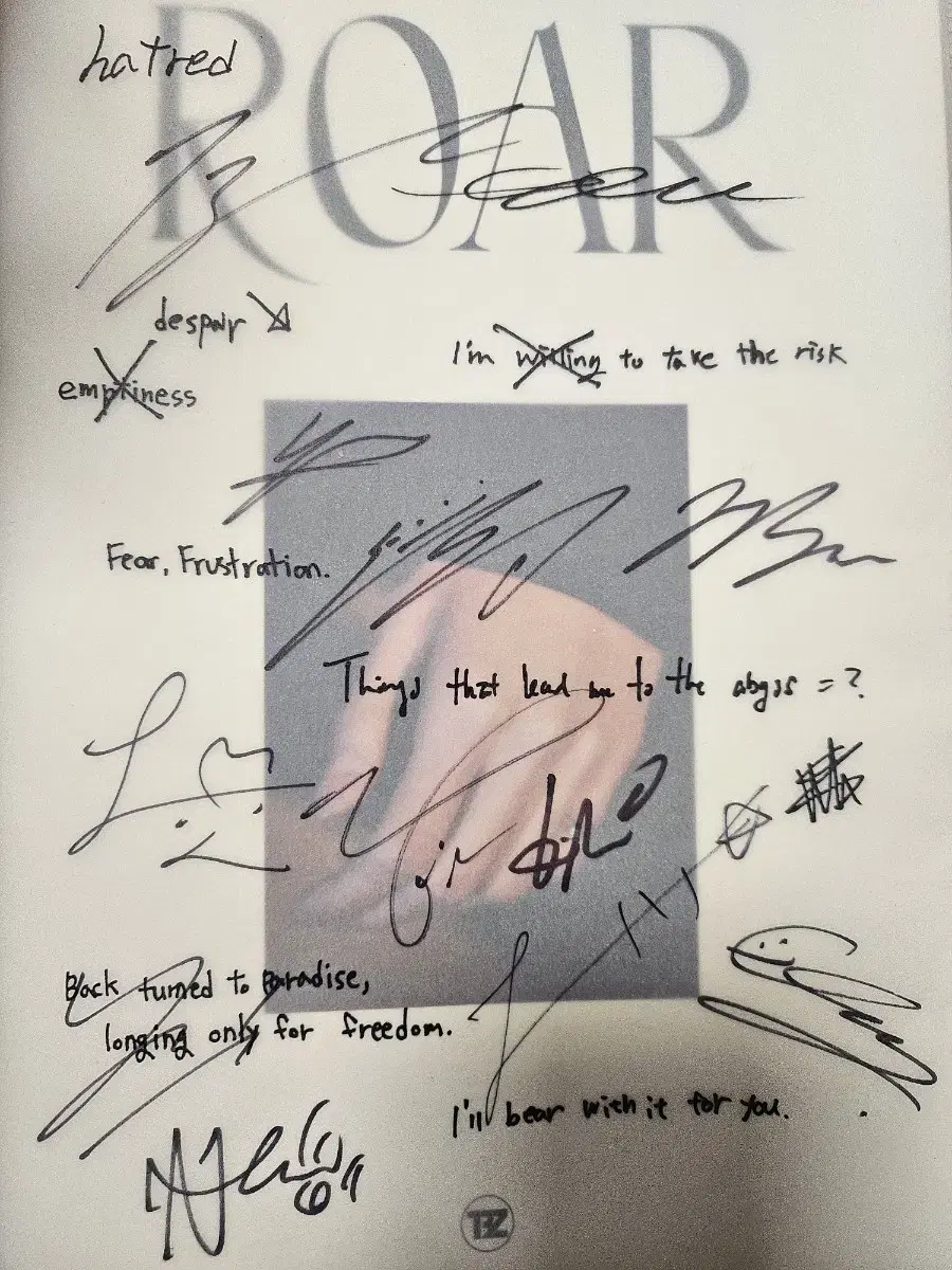 An album signed by all the members of the Boyz.