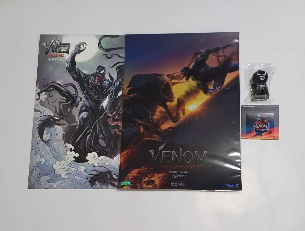 Venom Week 3 poster, keyring, and slides.