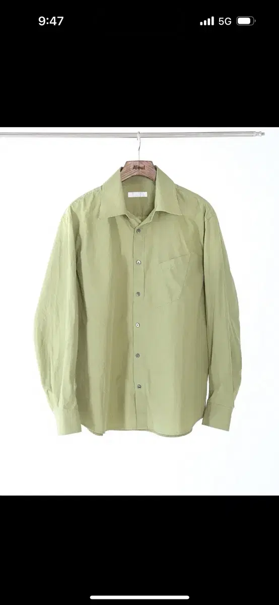 I'm selling an avocado green shirt by L. Lew.