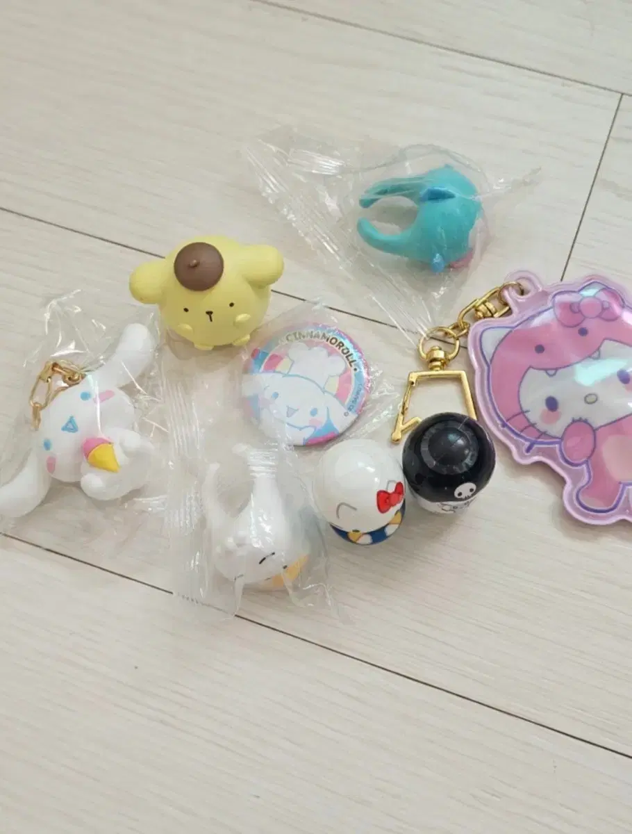 Sanrio sells keyrings, badges, sashes, rings, and more in bulk.