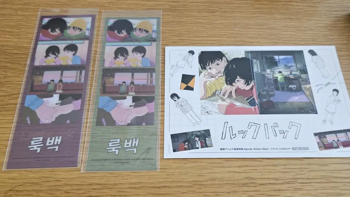 I'm selling 2 lookback bookmarks + stickers bulk 