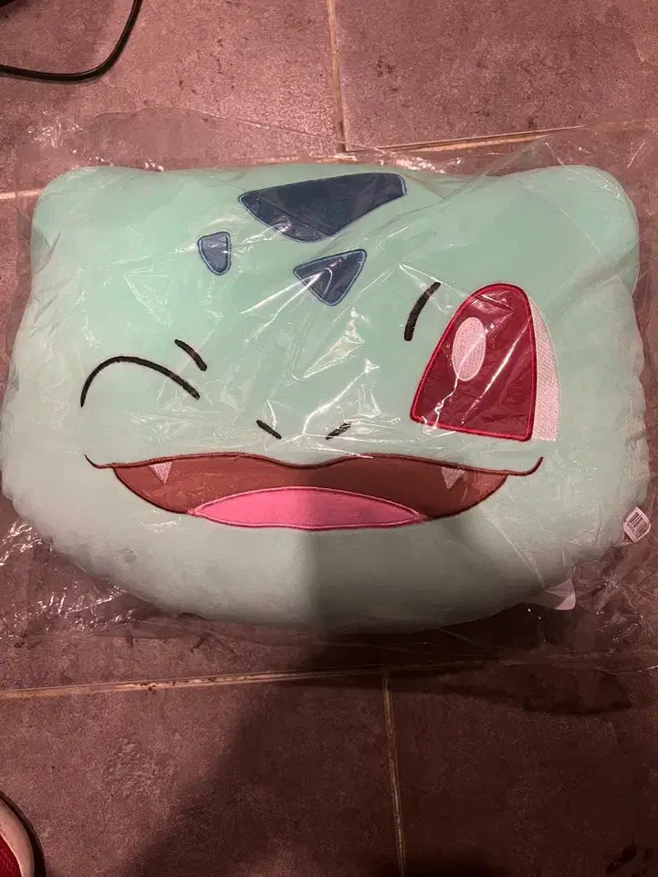 Selling an unsealed, unused) Pokémon Oddball face cushion.