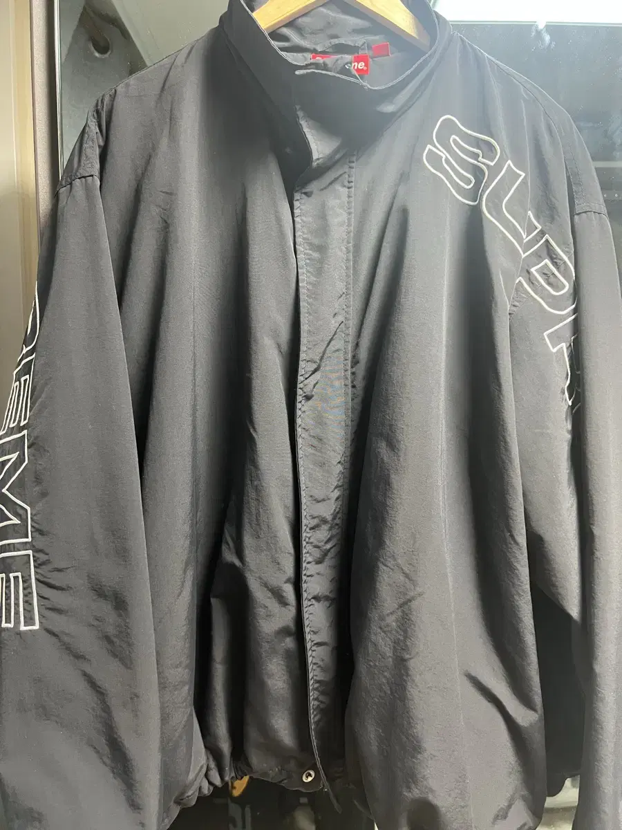 [L]Supreme Spellout Embroidered Track Jacket Black