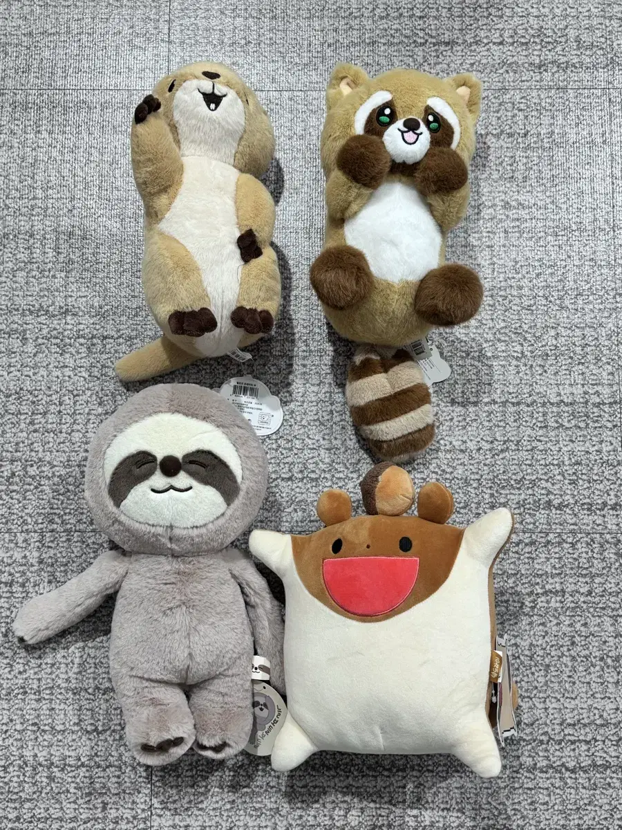 Prairie dog, raccoon, sloth, and flying squirrel dolls