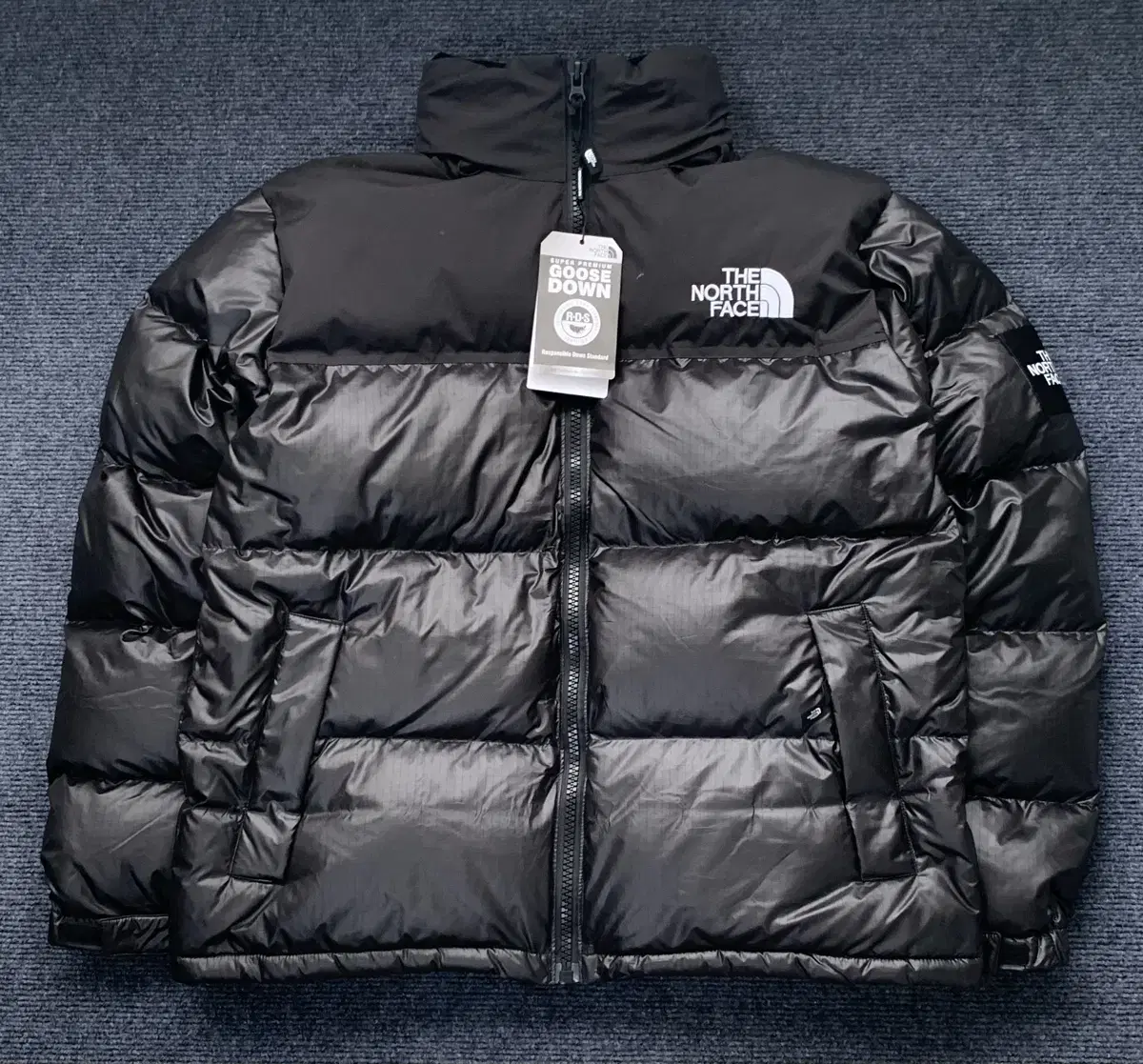 The North Face 1996 Knopsie Novelty Glossy Black Padded