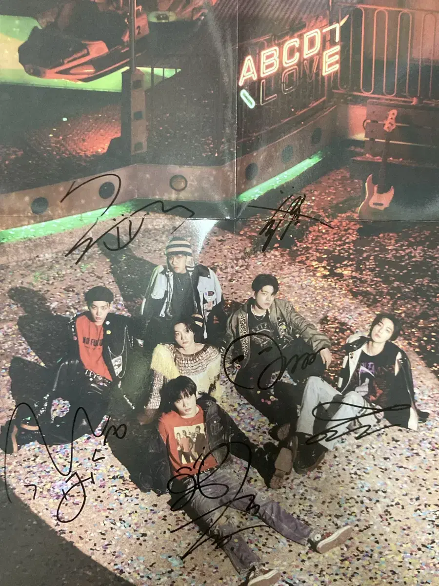 Poster signed by all boynextdoor members.