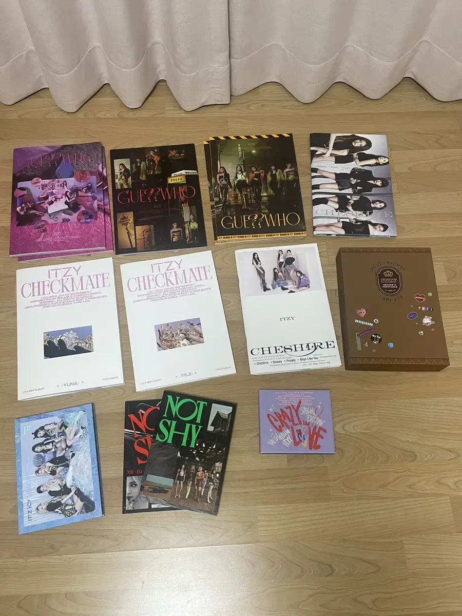 Itzy album, season's greetings, and photocards.