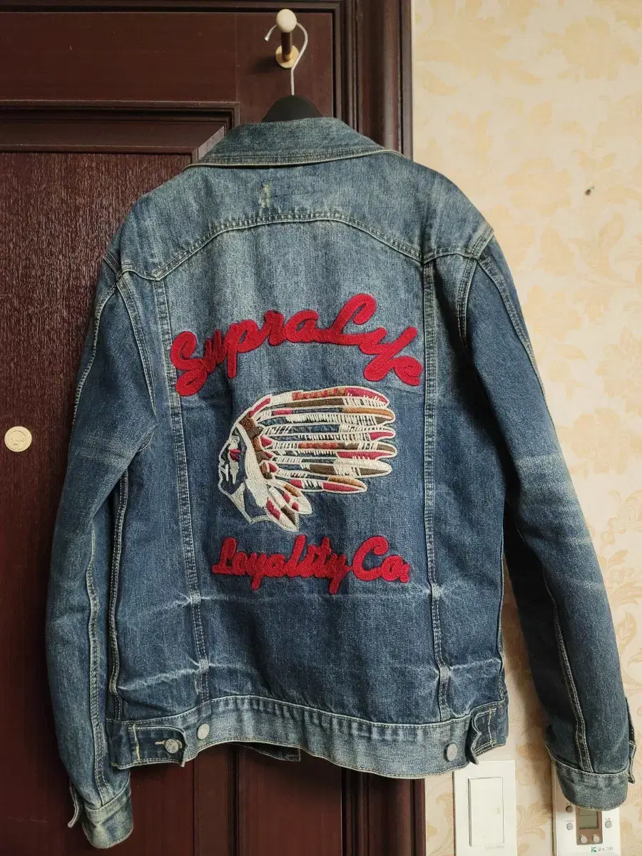 100-105 Trekker jean jacket with fraying and back embroidery