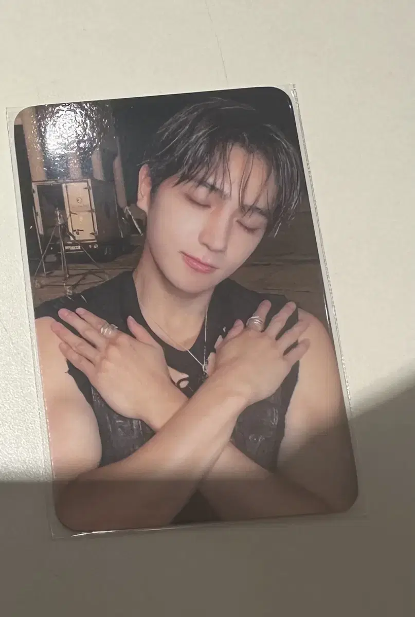 The Boyz with muu hyunjae photocard in a cage