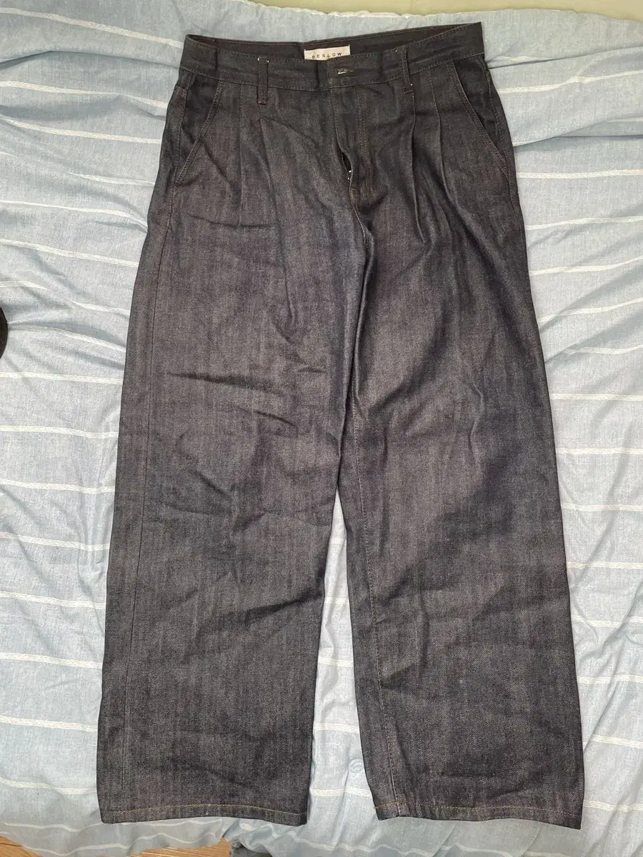 I'm selling a size 34 non-slouchy two-tuck wide denim.