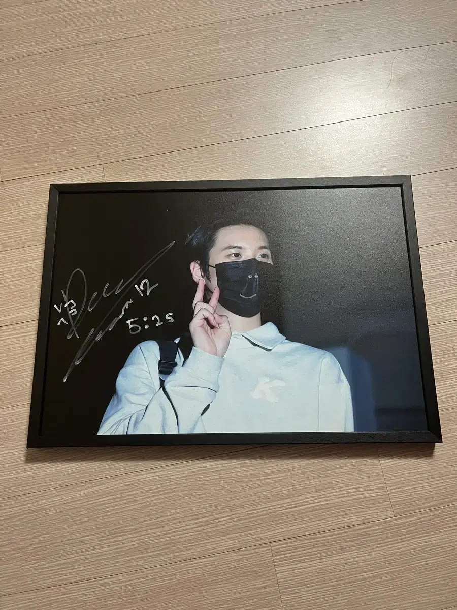 Lucy shin gwangil handwrites sign and sells frames.