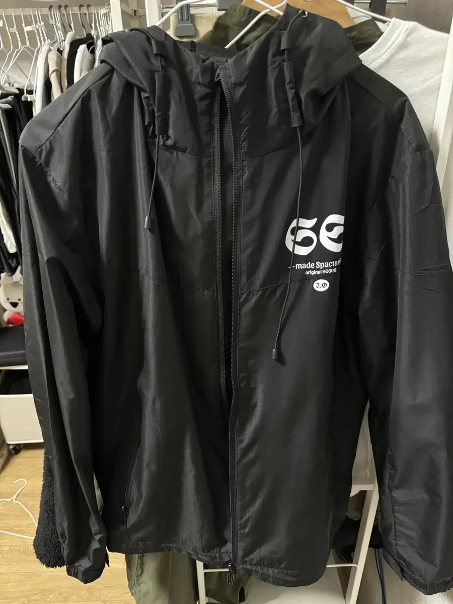 I have a new lightweight and practical black windbreaker for sale