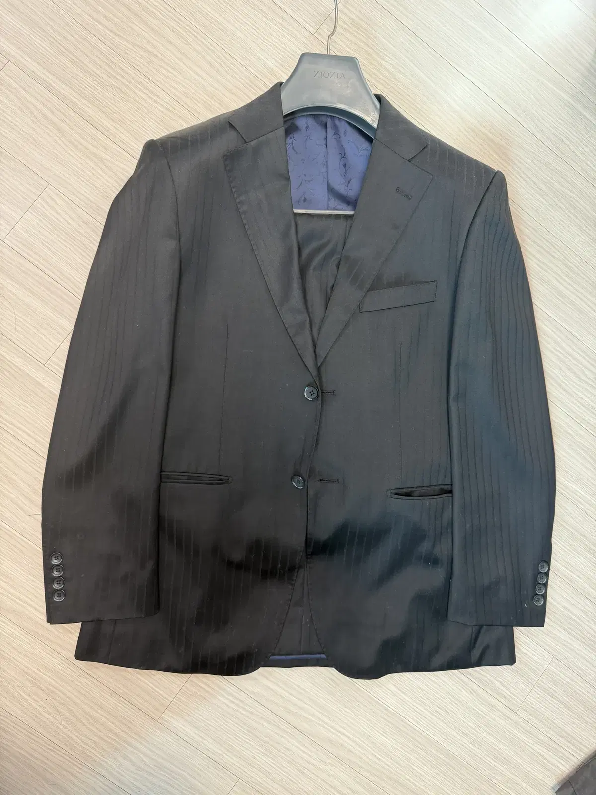 Setting up a cleaner fresh suit top and bottom