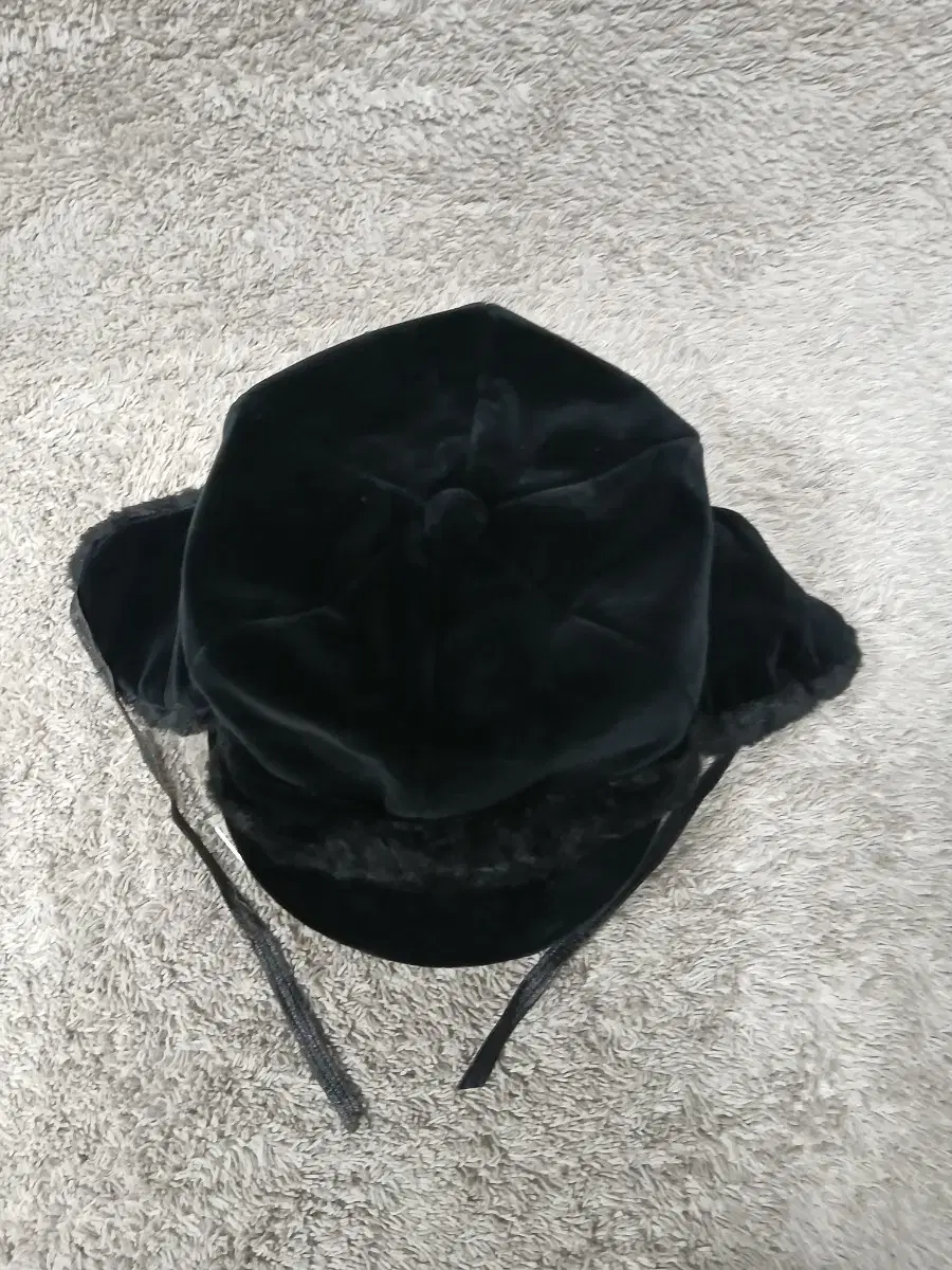 Black hat with velvet earmuffs