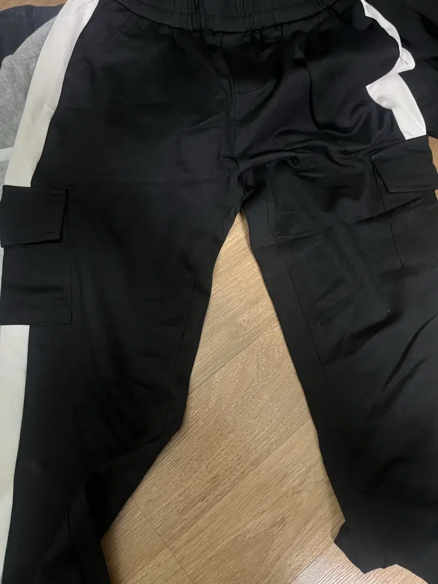 Black training jogger pants in variegated colors