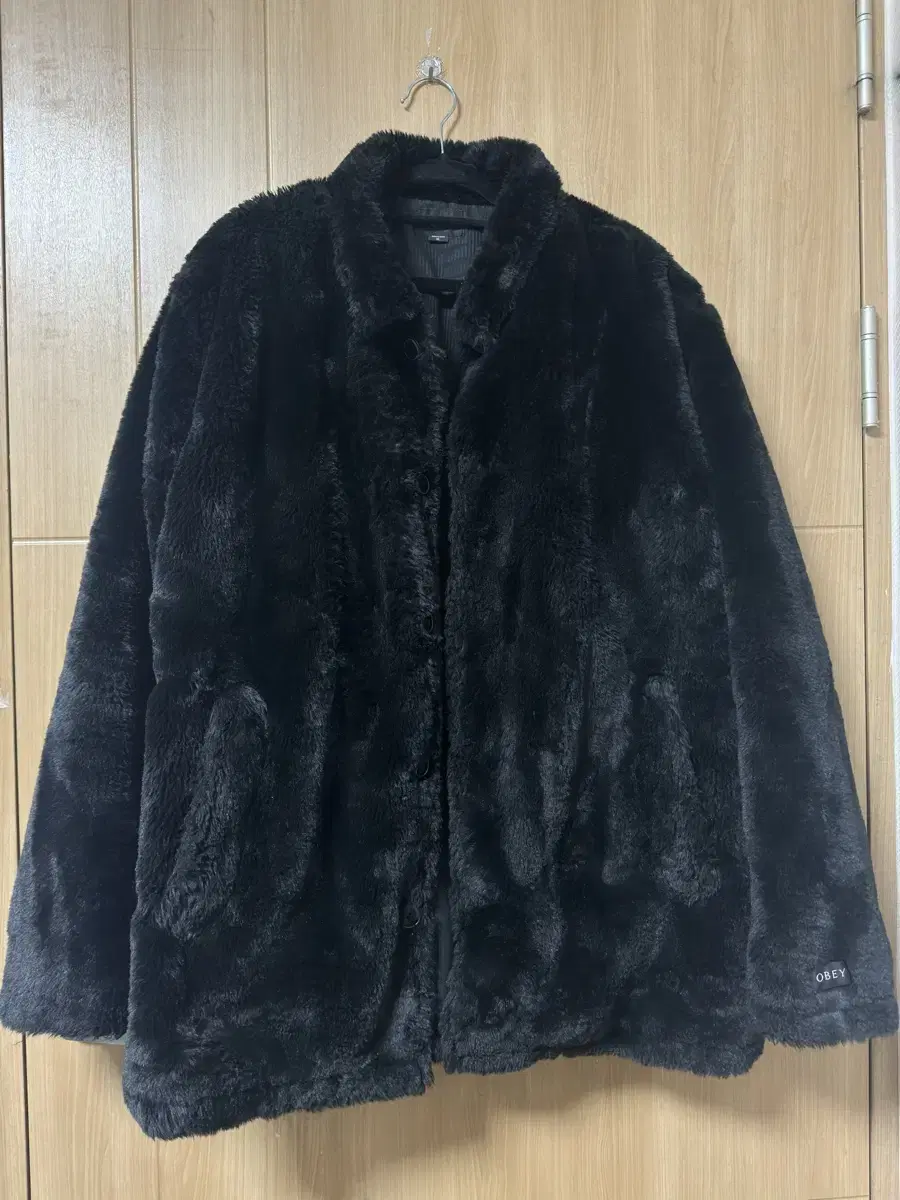 Black fur jacket by OBEY