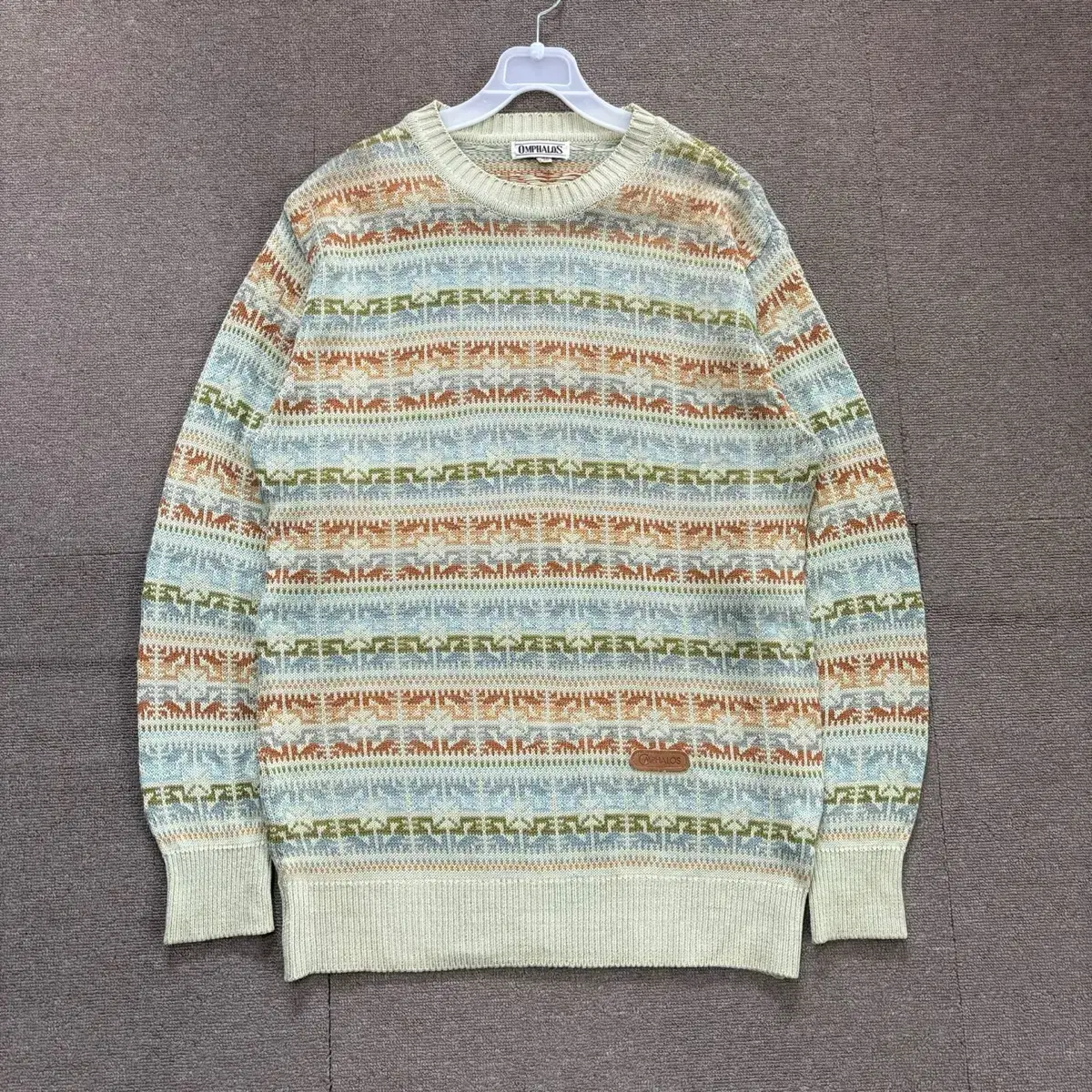 100% knit with a vintage overfit pattern.