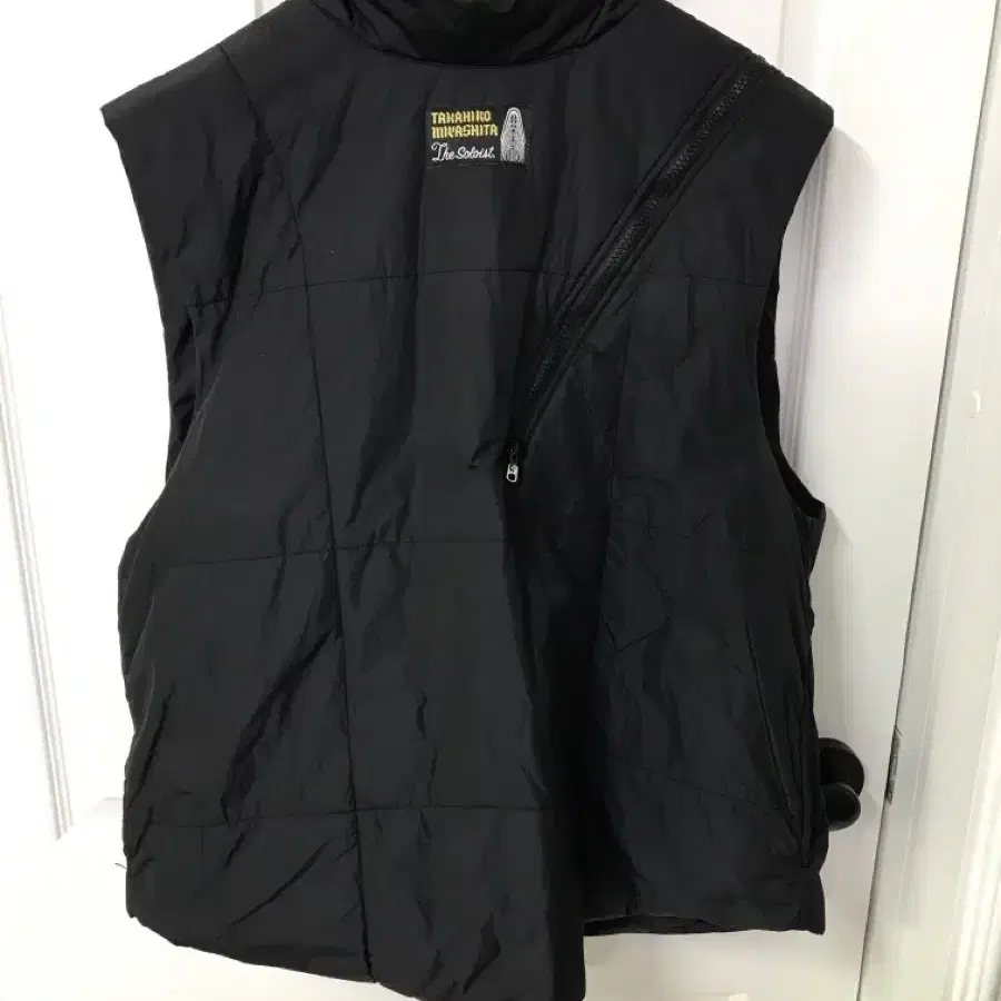 SOLOIST DOUBLE ZIP REVERSE PUFFY VEST 50