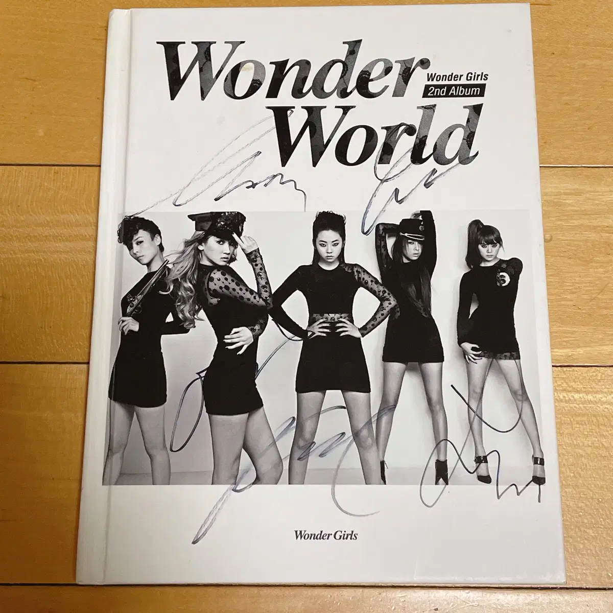 An album signed by all the WonderGirls from their second album.