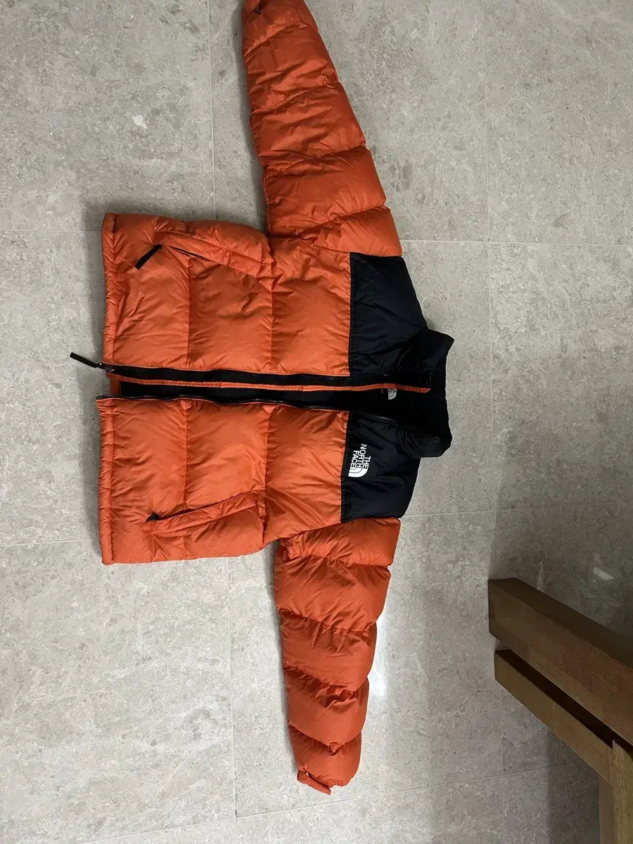 The North Face Padded Orange NopsiXXL sells