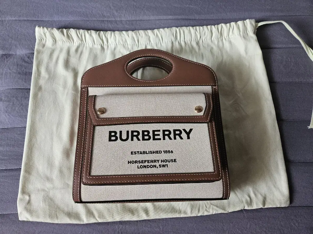 Burberry Mini Two-tone Canvas and Leather Pocket Bag for sale.