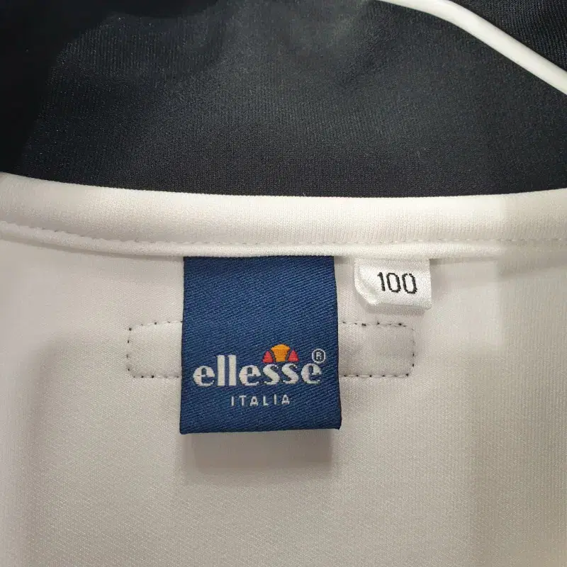 E8722 ELLESSE 남100 화이트 반집업 상의 오염O/더크