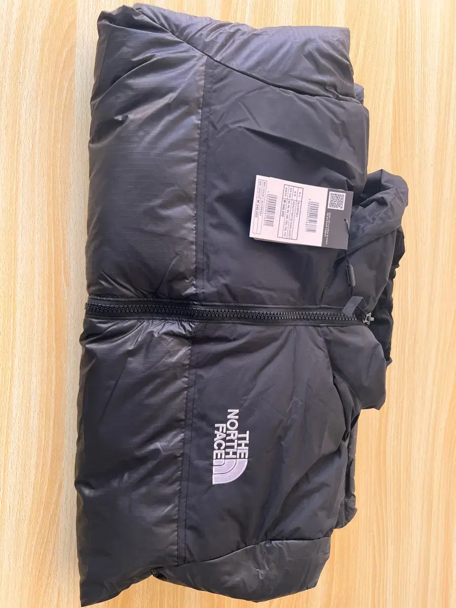 The North Face 1996 Knopsie Novelty Glossy Black Padded