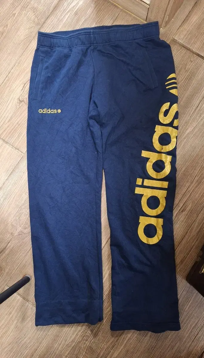 Unused Adidas winter tracksuit long pants size 34-36 (see photo for tape measure).