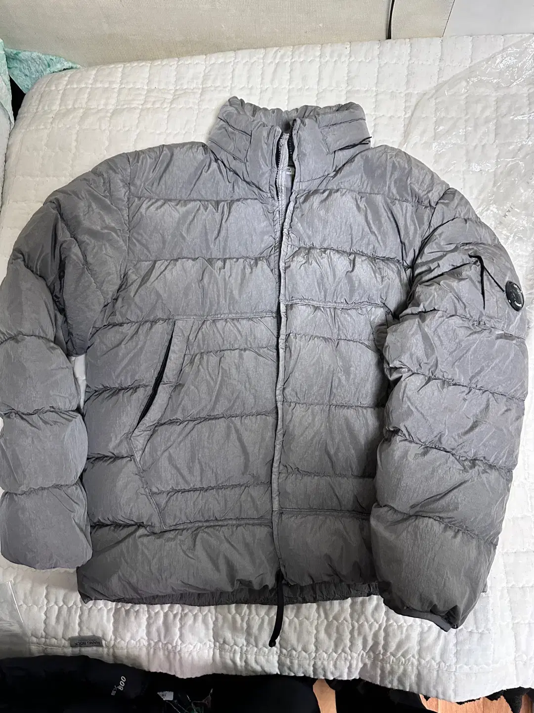 [52] CP Company Eco Chrome Metal Gray Padding Down sells.