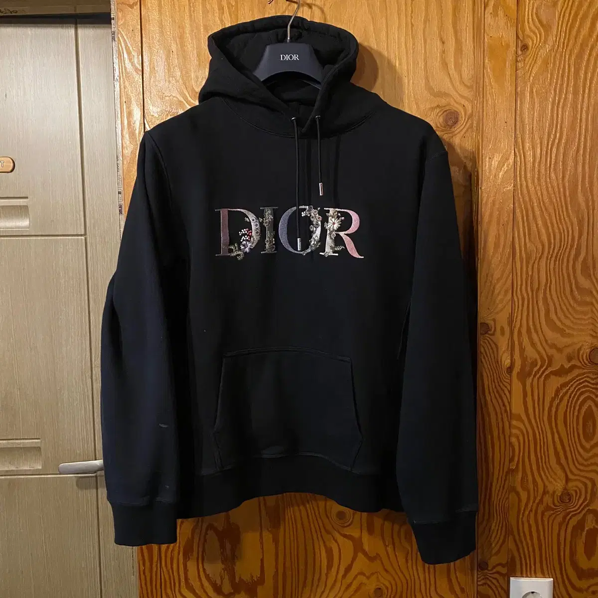 Dior flower embroidered black hoodie sell.