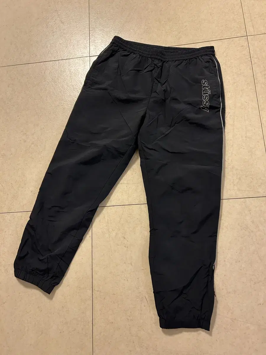 Stussy track pants size M for sale