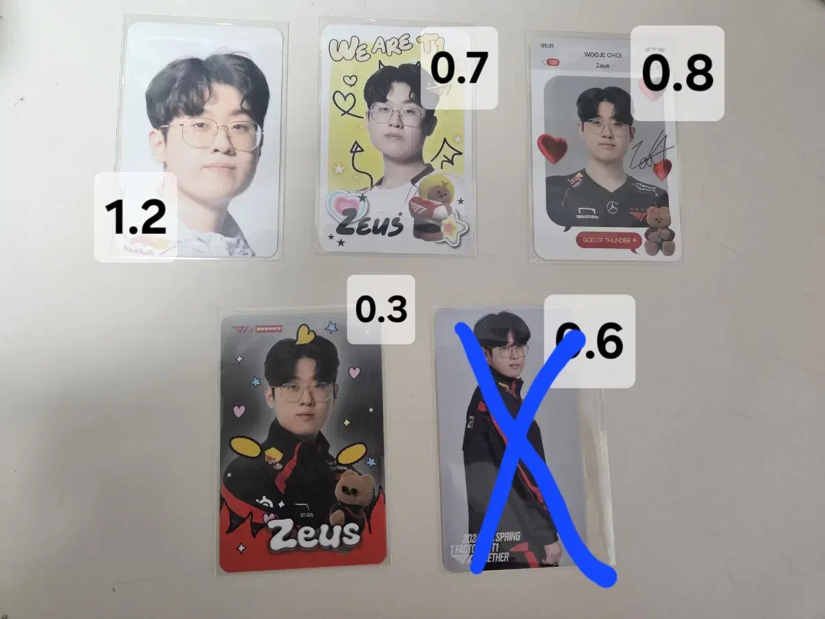 T One Han Han Zeus photo cards, postcards, and keyrings are sold.