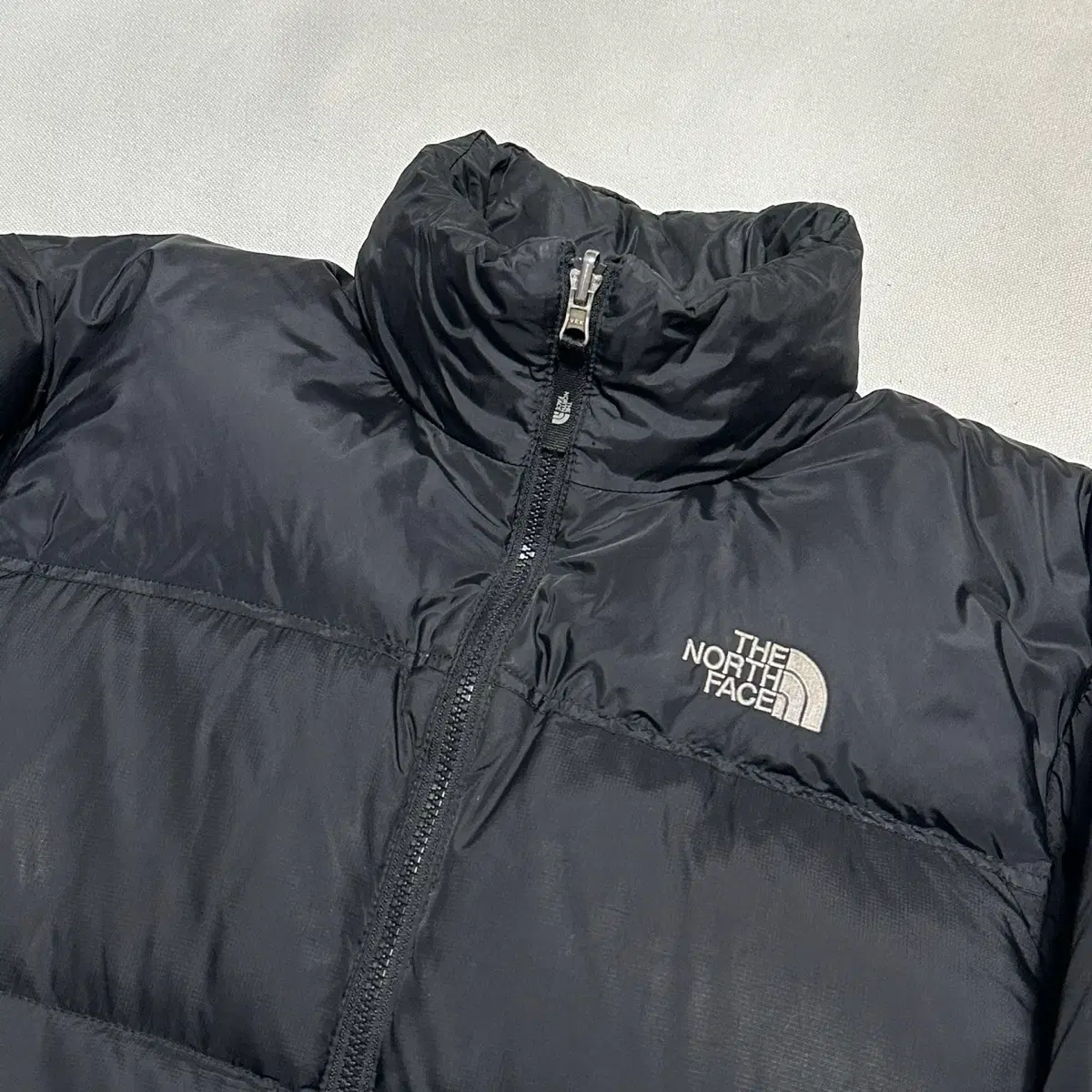 S The North Face USA Nupsi 700 Matte Black Padding