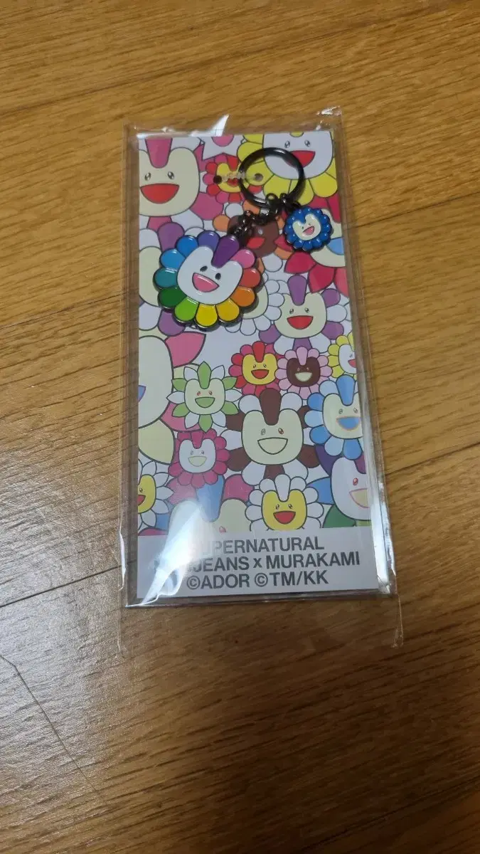 New Jeans Murakami Metal keyring sells.