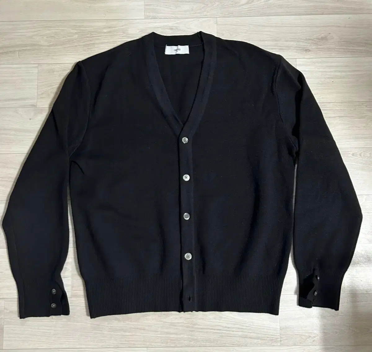 I'm selling an Elmood cardigan in black, size 48.