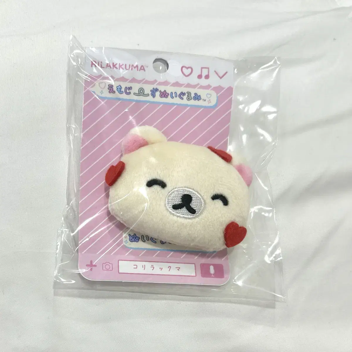 Korirakkuma Sanx doll sells badges