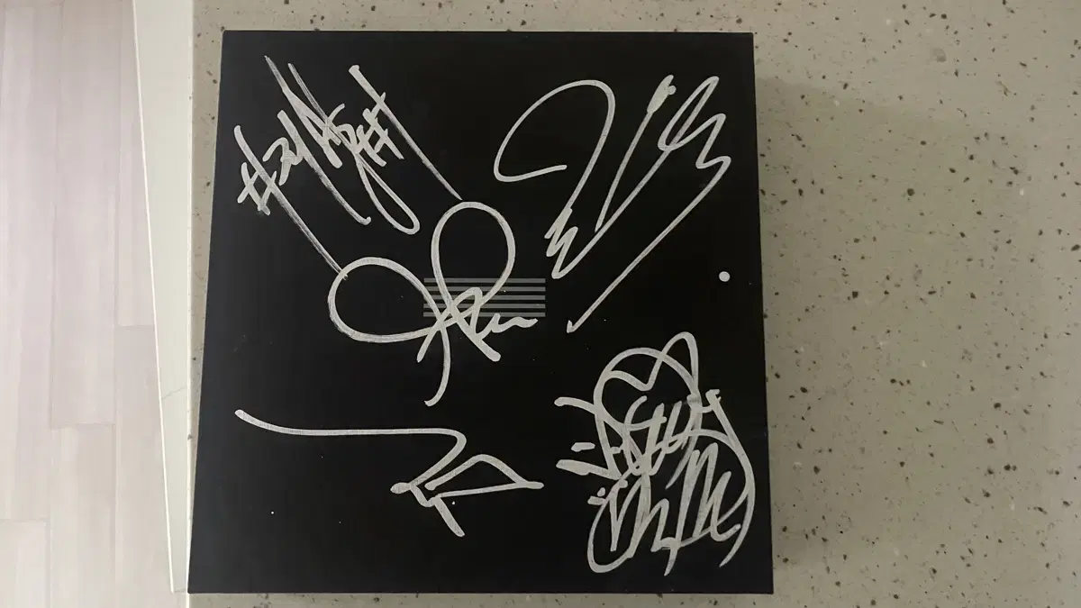 Former BIGBANG member sign May's canvas album