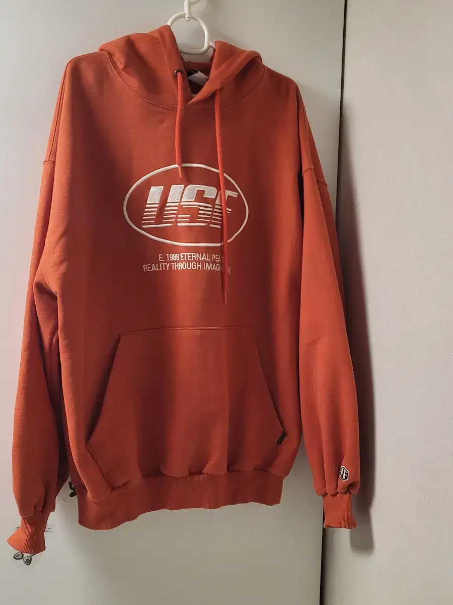 Urbanstuff Face Logo Embroidered Hoodie in Orange L