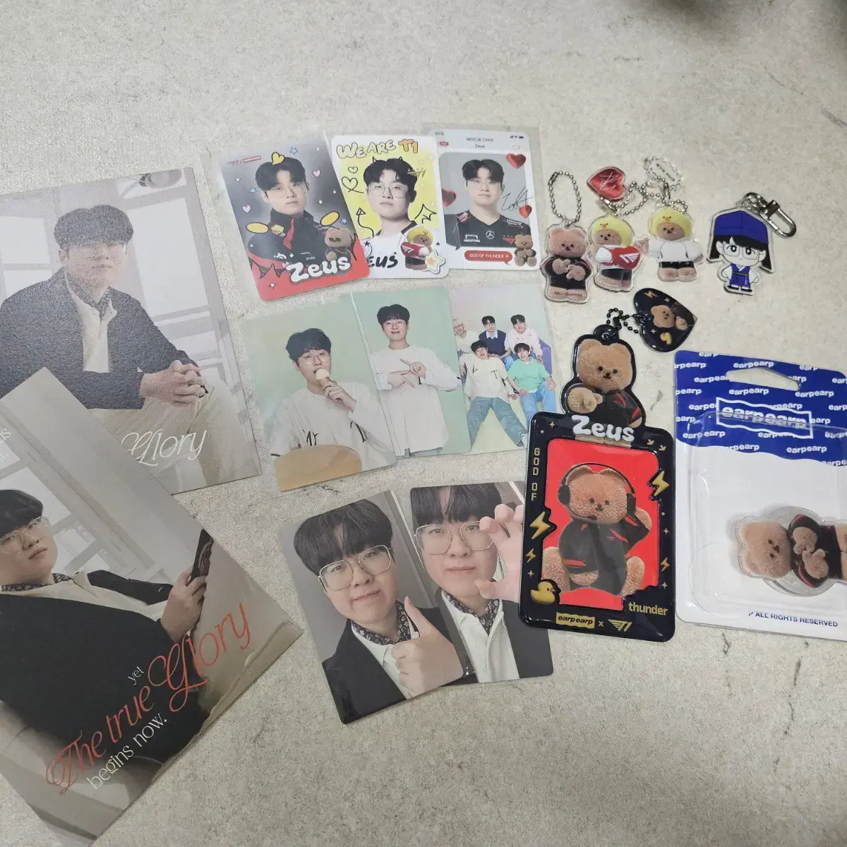 Zeus postcard + keyring + poka + GripTalk + photocard holder (ugh)