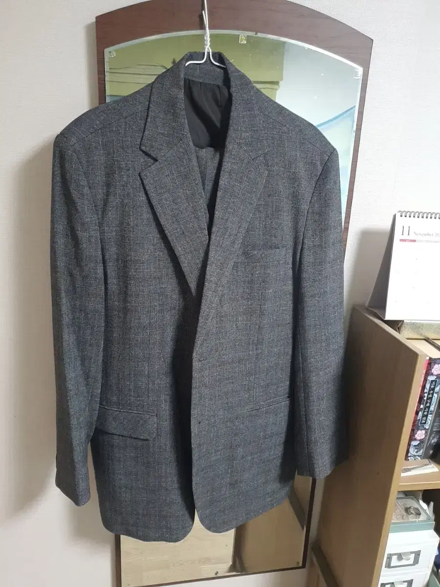 Gray color 3-piece suit set up for $9,000.