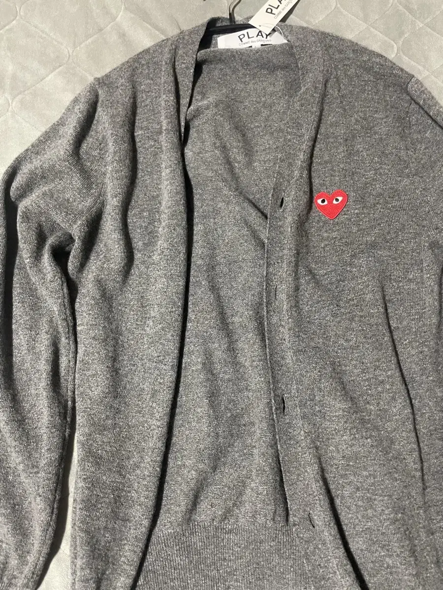 I sell Comme des Garçons cardigans