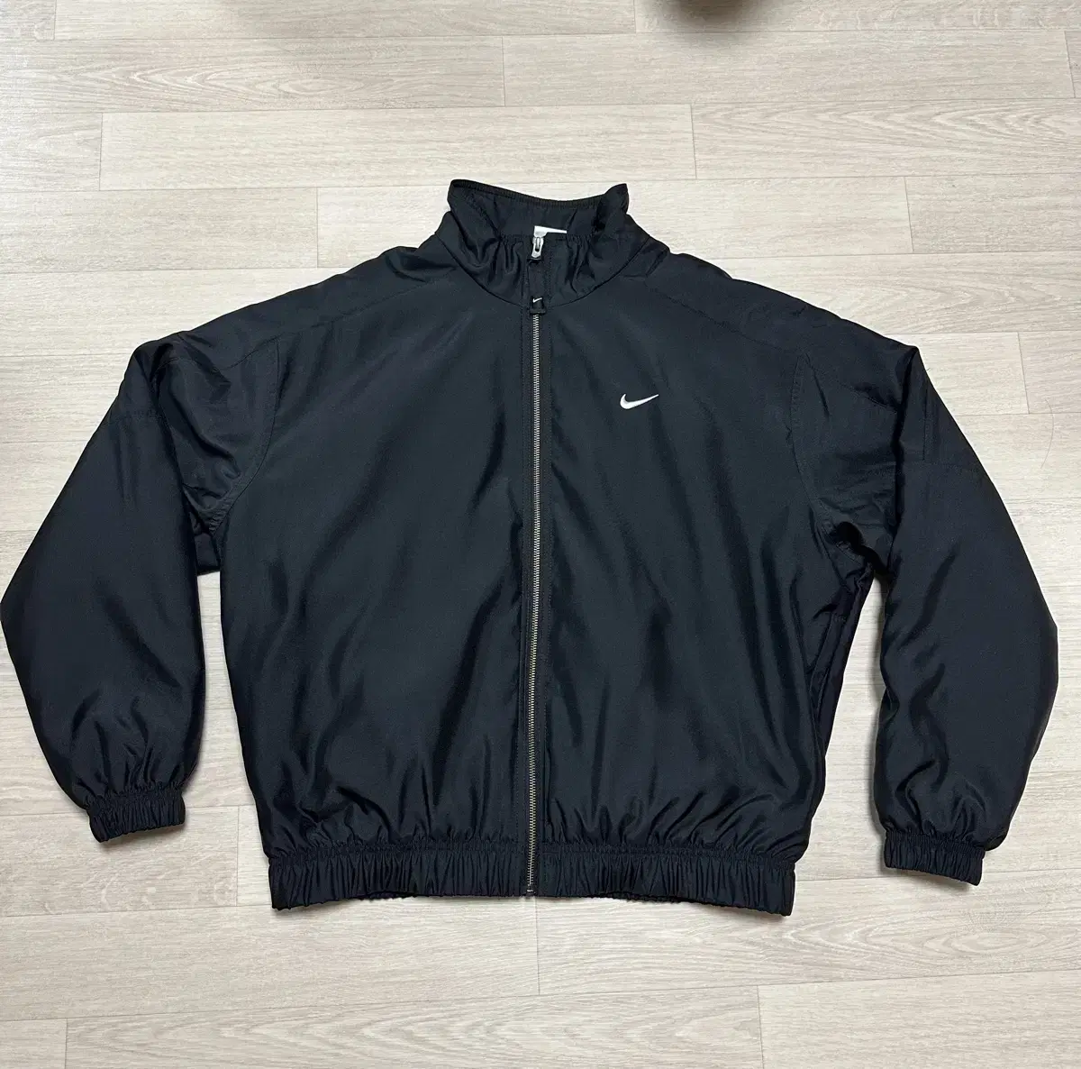 Nike NRG Solo Swoosh Satin Bomber Jacket for sale.