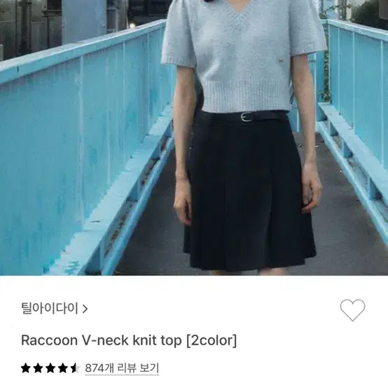 Raccoon V-neck knit top