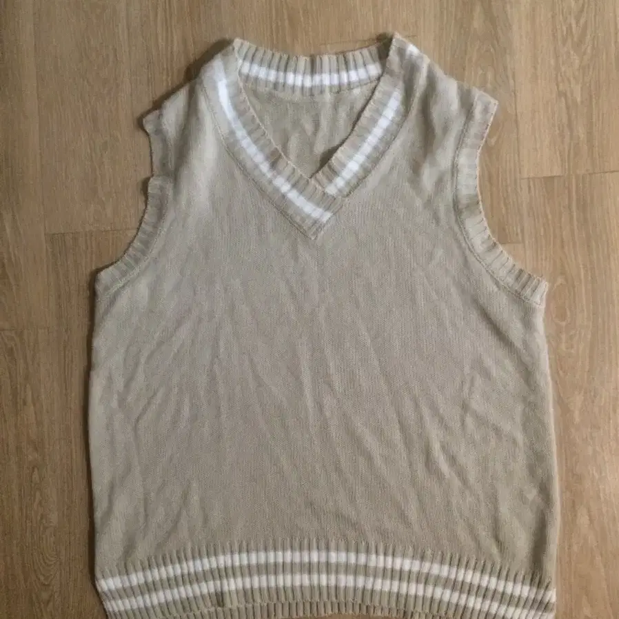 beige knitwear vest