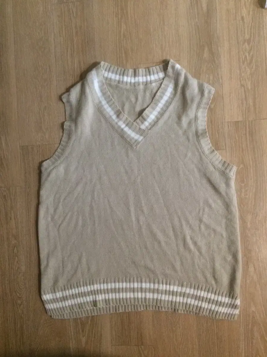 beige knitwear vest