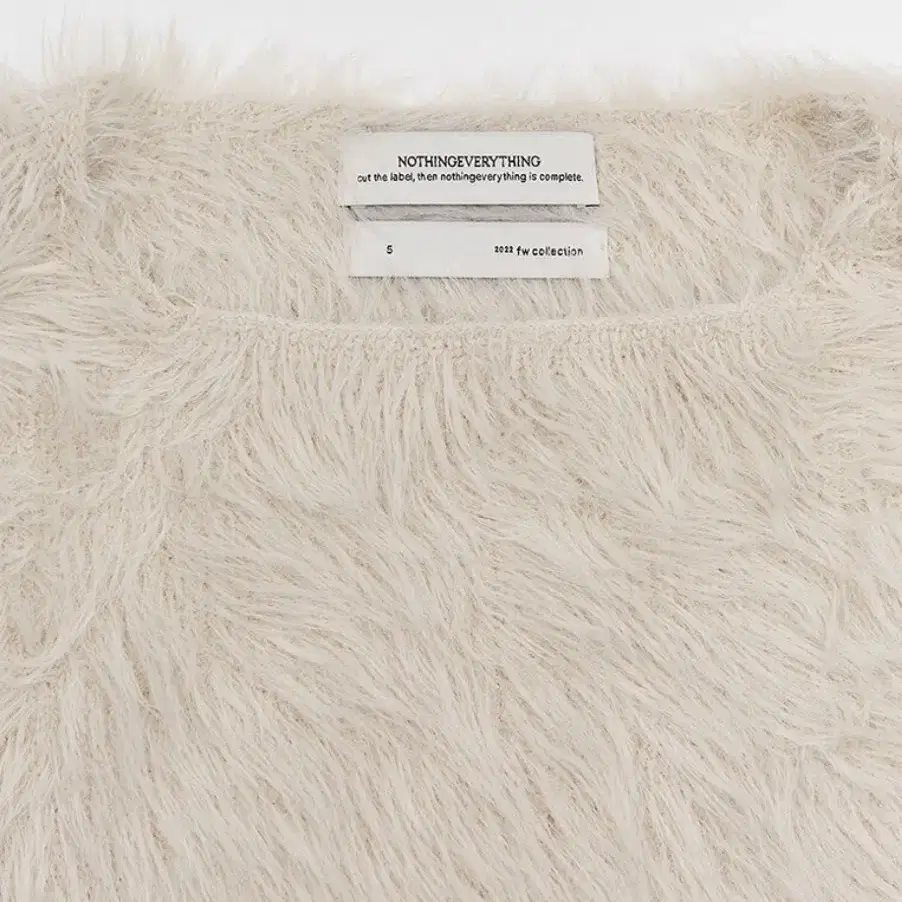 낫띵에브리띵 open side vegan fur vest ivory